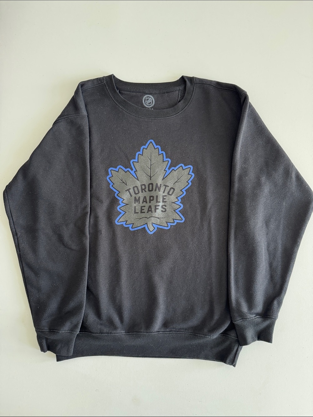 NHL Toronto Maple Leafs Black Crewneck with Blue-Outlined Gray Leaf Logo